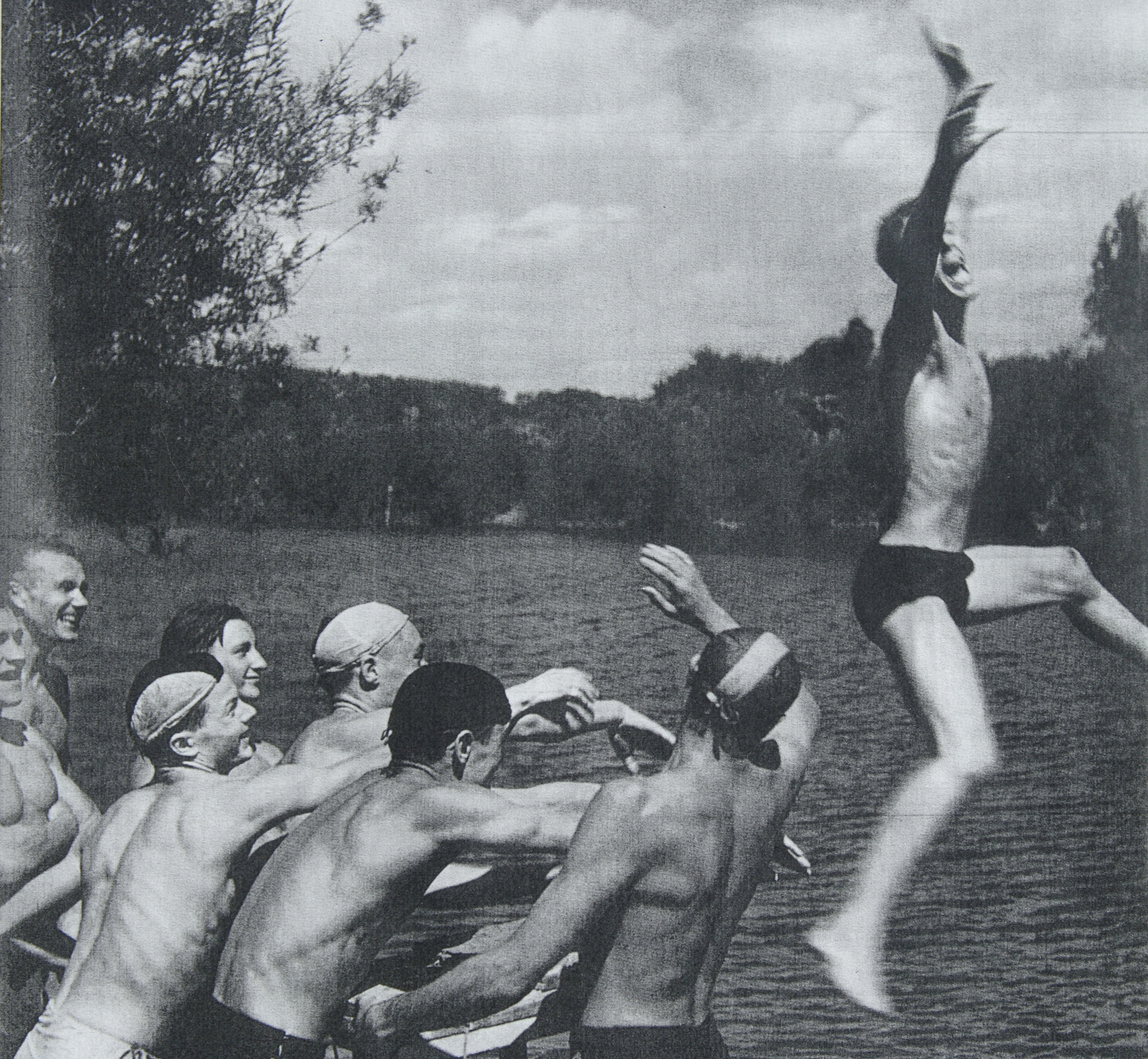 young man jumping in the lake