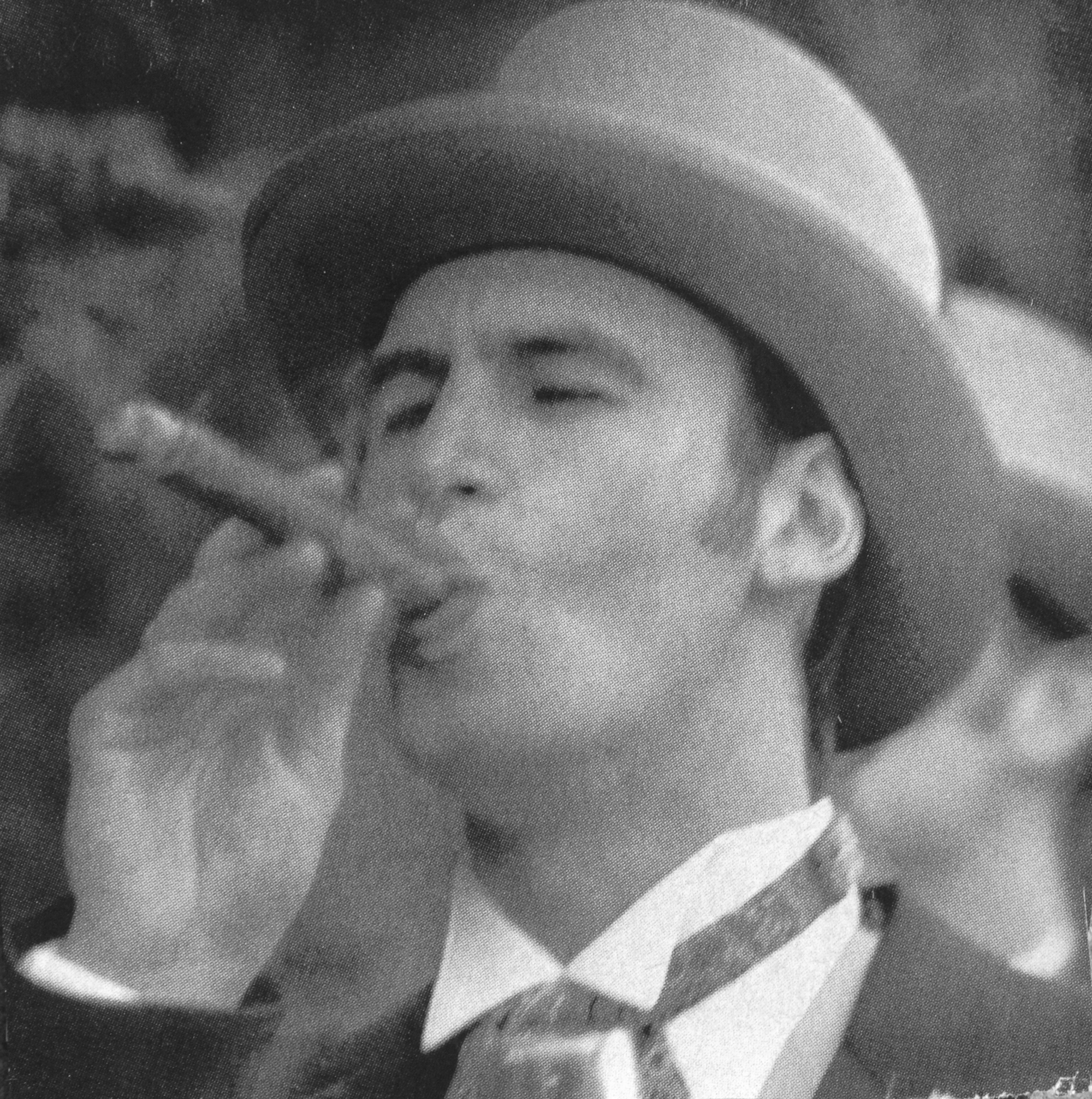 man in hat smoking cigar
